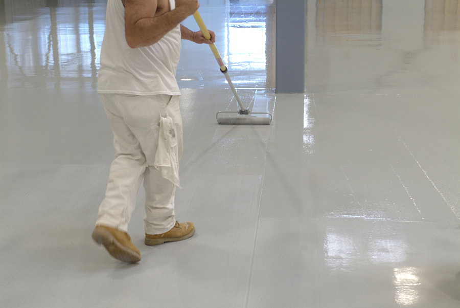 This is a picture of a man cleaning the floor.